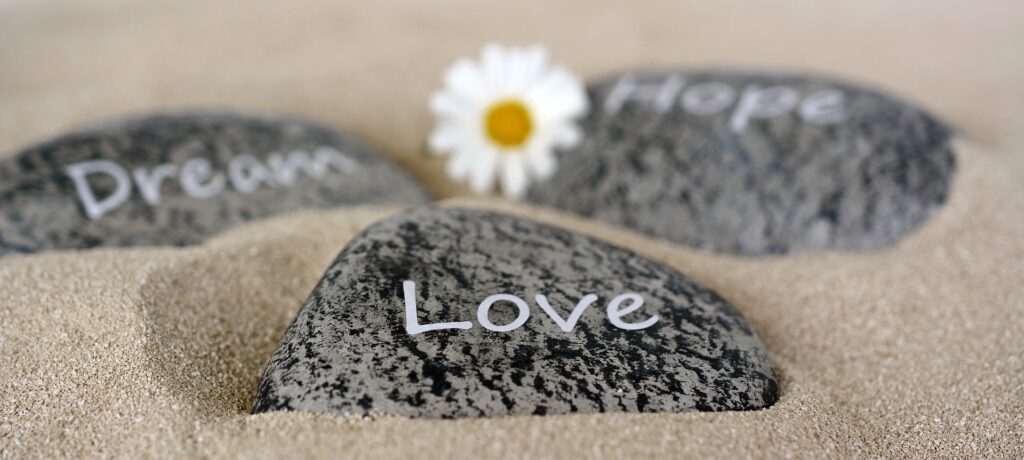 image of stones with love, hope, and dream words on them