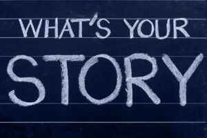 Text written on chalkboard "What's Your Story"